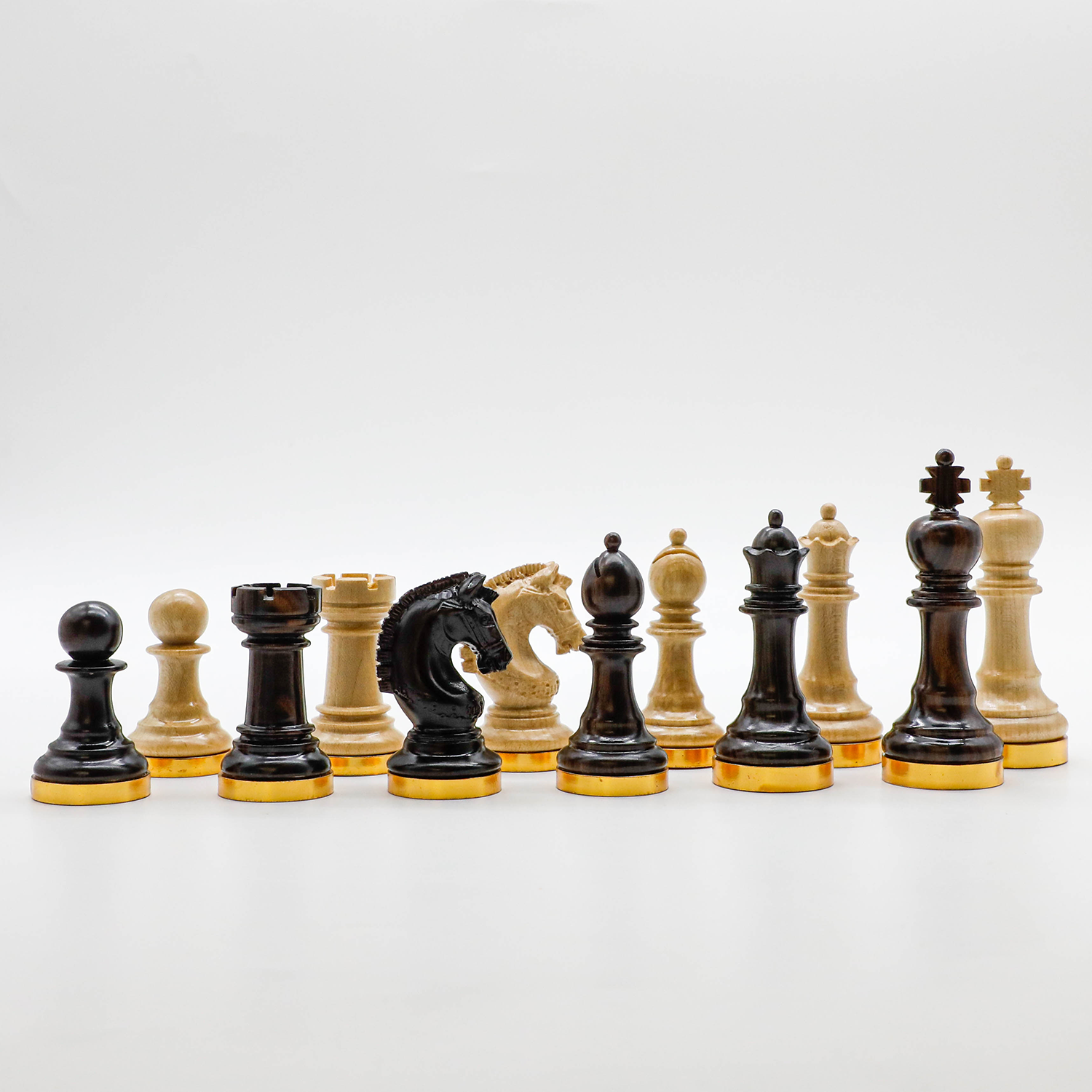 The Unique Ebony & Maple Chess Pieces With Gold-Plated Brass Base